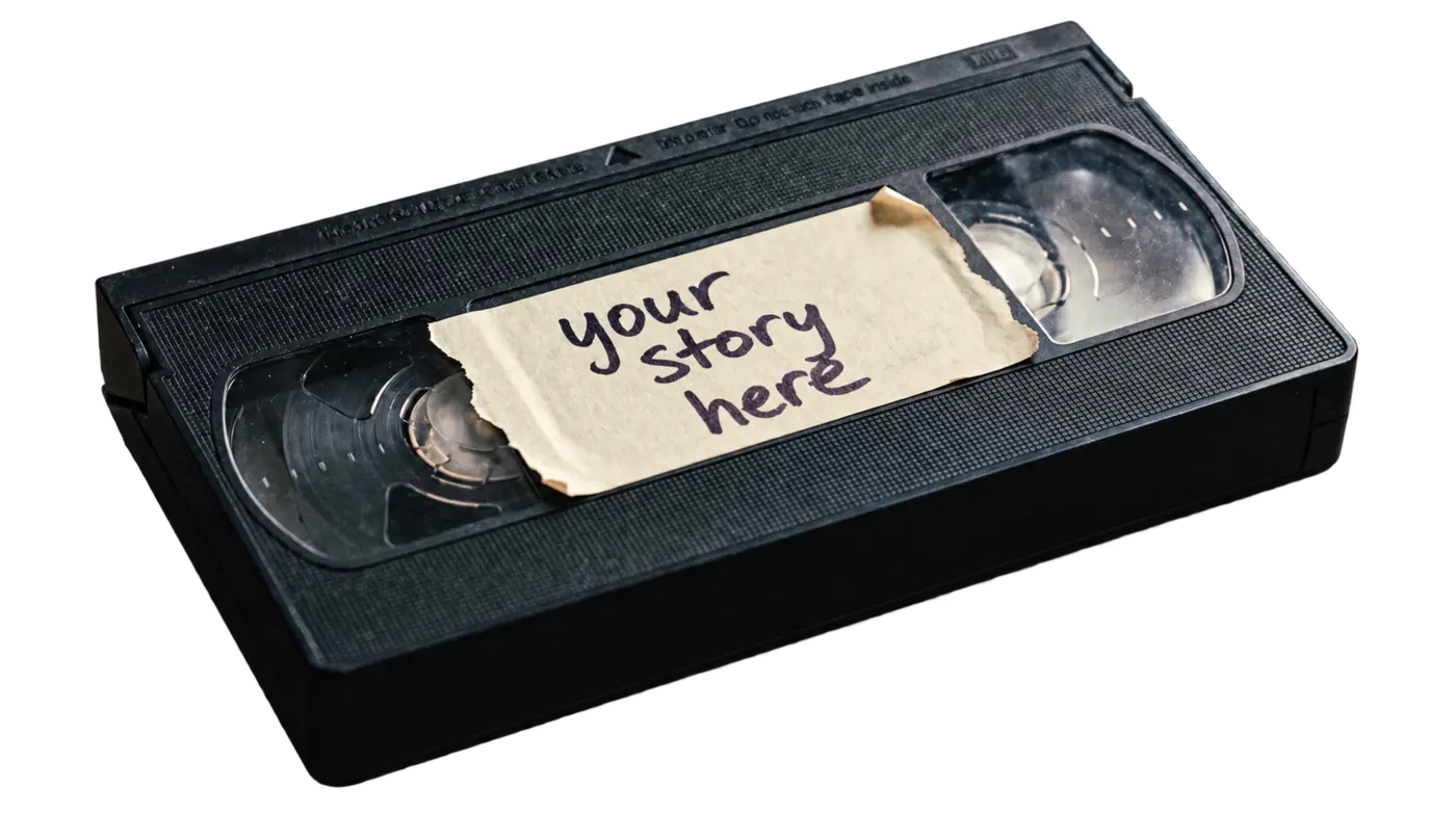 A worn blank VHS tape labelled Your story here